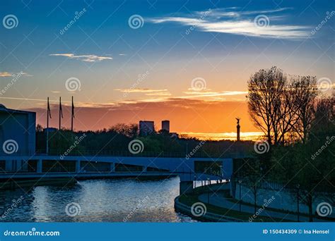 A View over the Spree at Sunset by Yvo von Schlieben: A Symphony of Light and Tranquility!